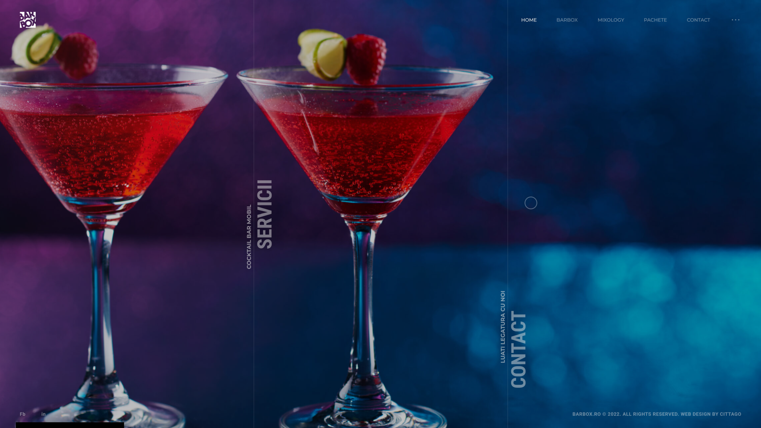 Two lit red cocktails on a moody blue-purple set, glowing against the dark