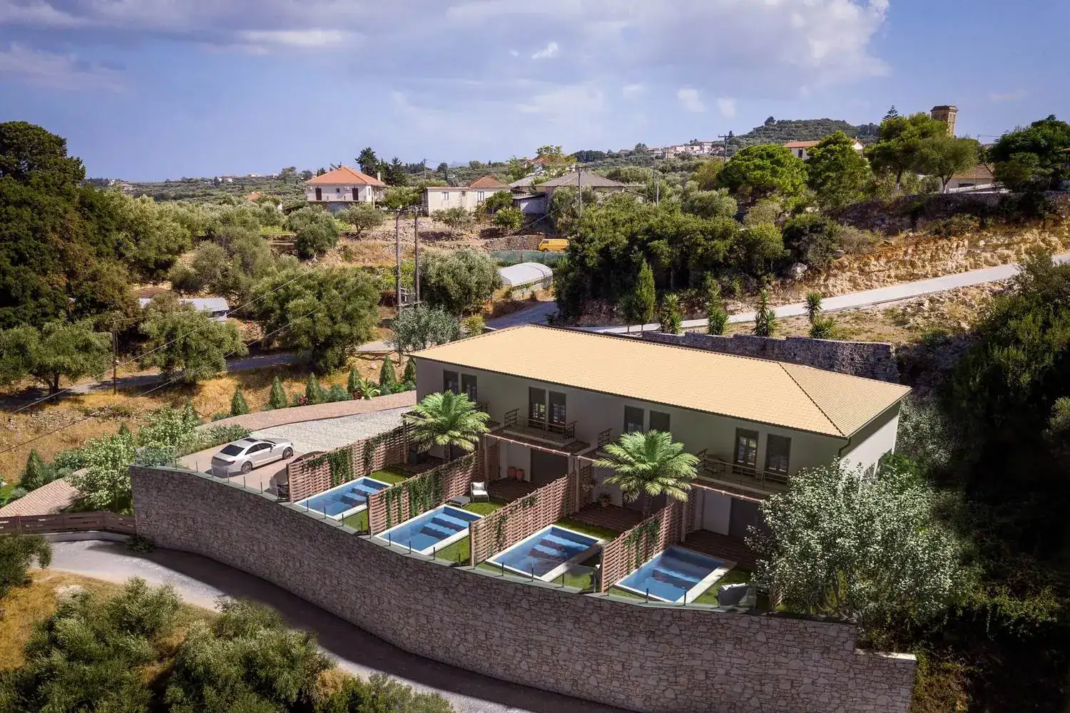 Aerial view of the Ela Home plot in Kypseli, Zakynthos, with the four private pools